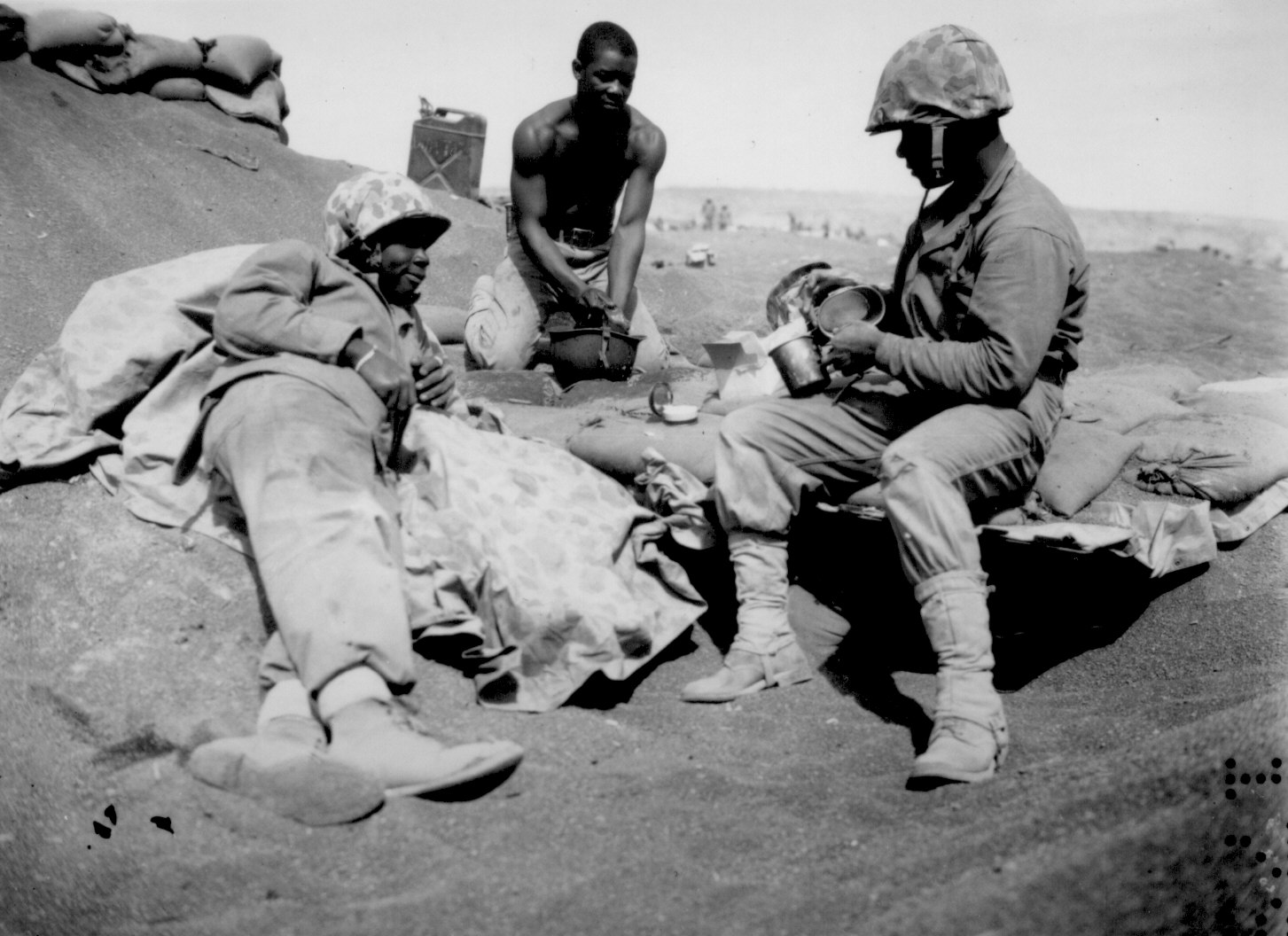 African-American US Marines Willie J. Kanody, Elif Hill, and John Alexander on a beach at Iwo Jima, Mar 1945