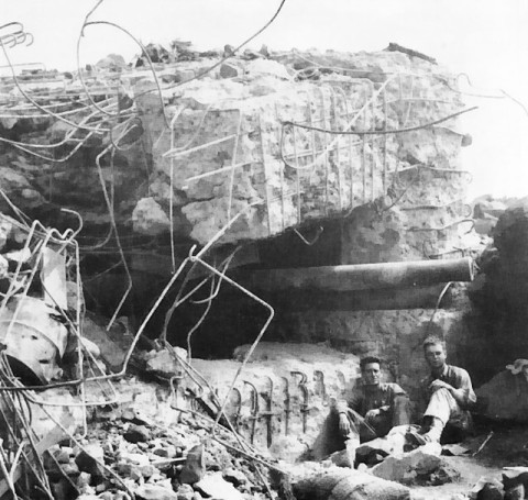 Japanese 120mm gun protuding from a cave opening, Iwo Jima, Japan, circa Mar 1945