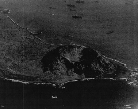 View of the southwestern face of Mount Suribachi, Iwo Jima, Japan, 7 Mar 1945; photo taken from an aircraft of USS Anzio