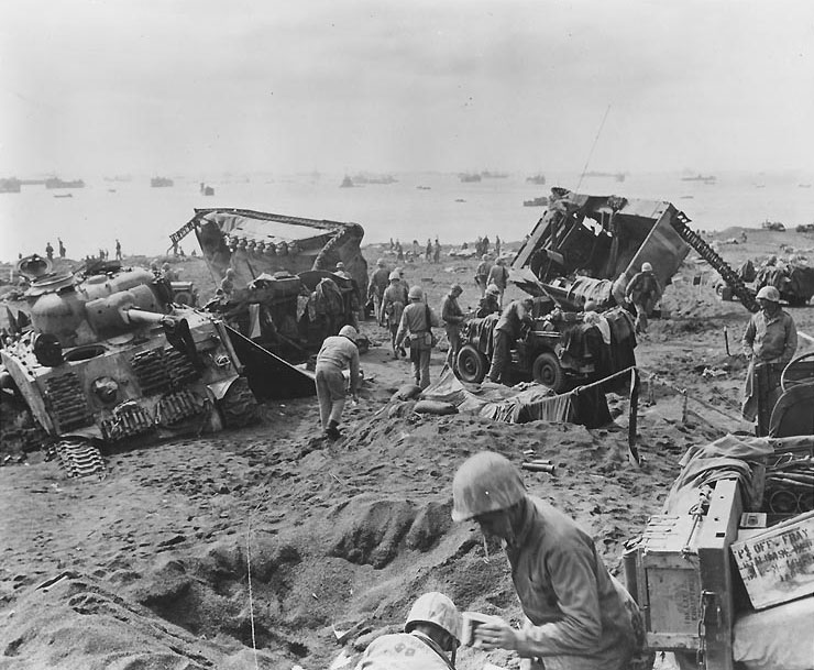 Wrecked tank and LVTs on Blue Beach No. 1, Iwo Jima, Feb 1945