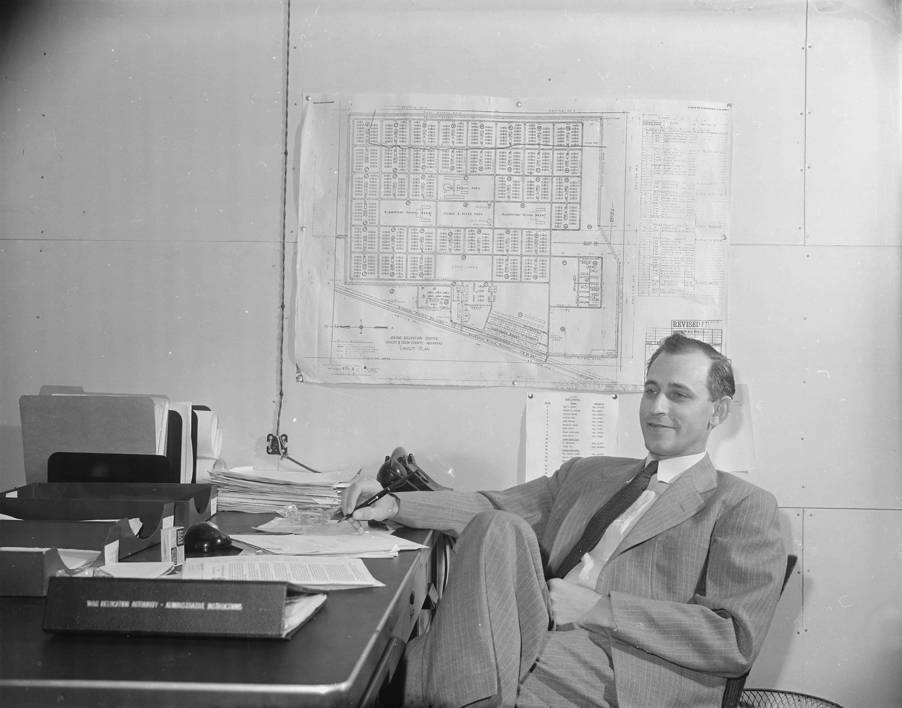 Project Director Paul Taylor of Jerome War Relocation Center at his office, Arkansas, United States, 18 Nov 1942, photo 2 of 2