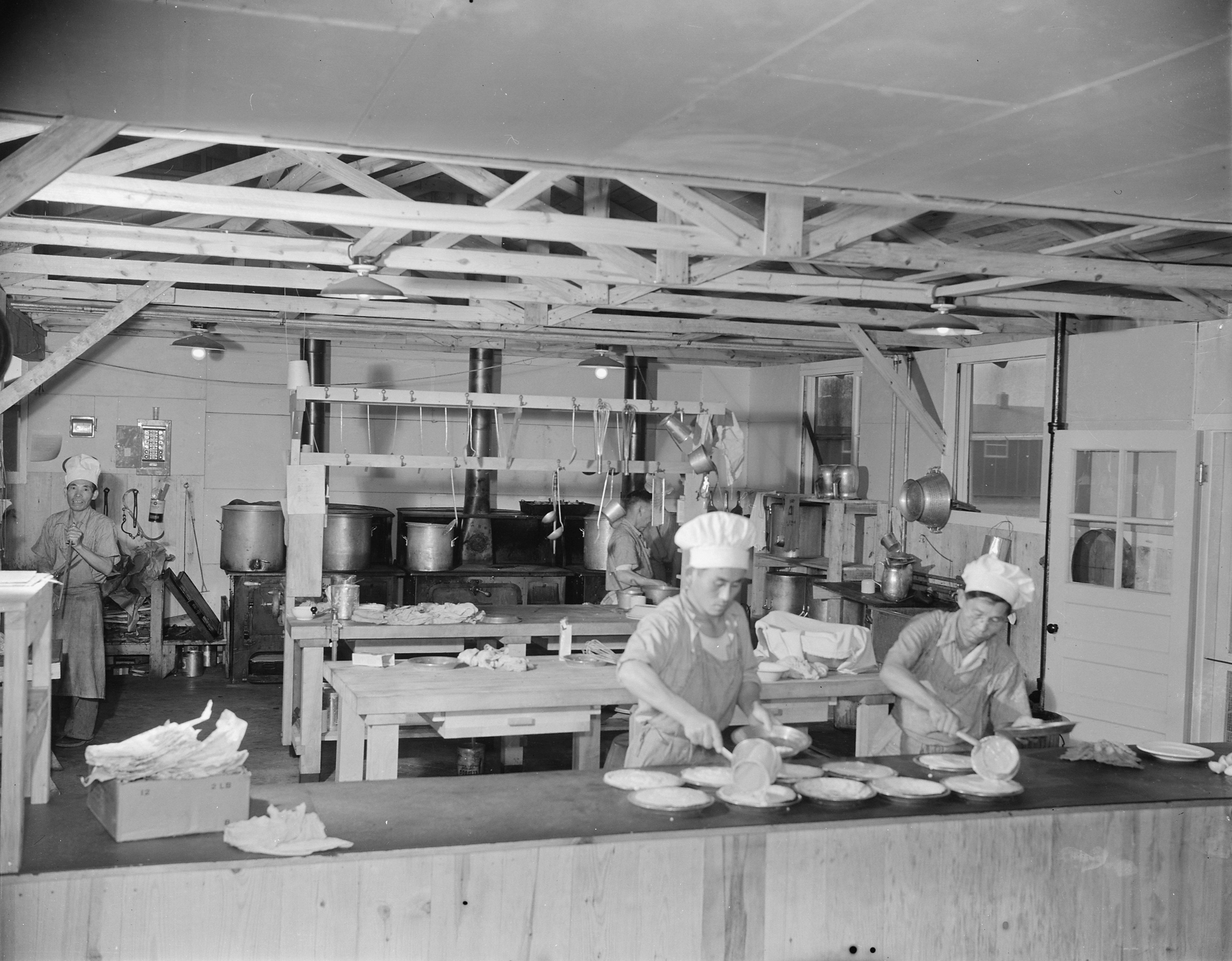 Staff members of Block 7 kitchen at work, Jerome War Relocation Center, Arkansas, United States, 18 Nov 1942