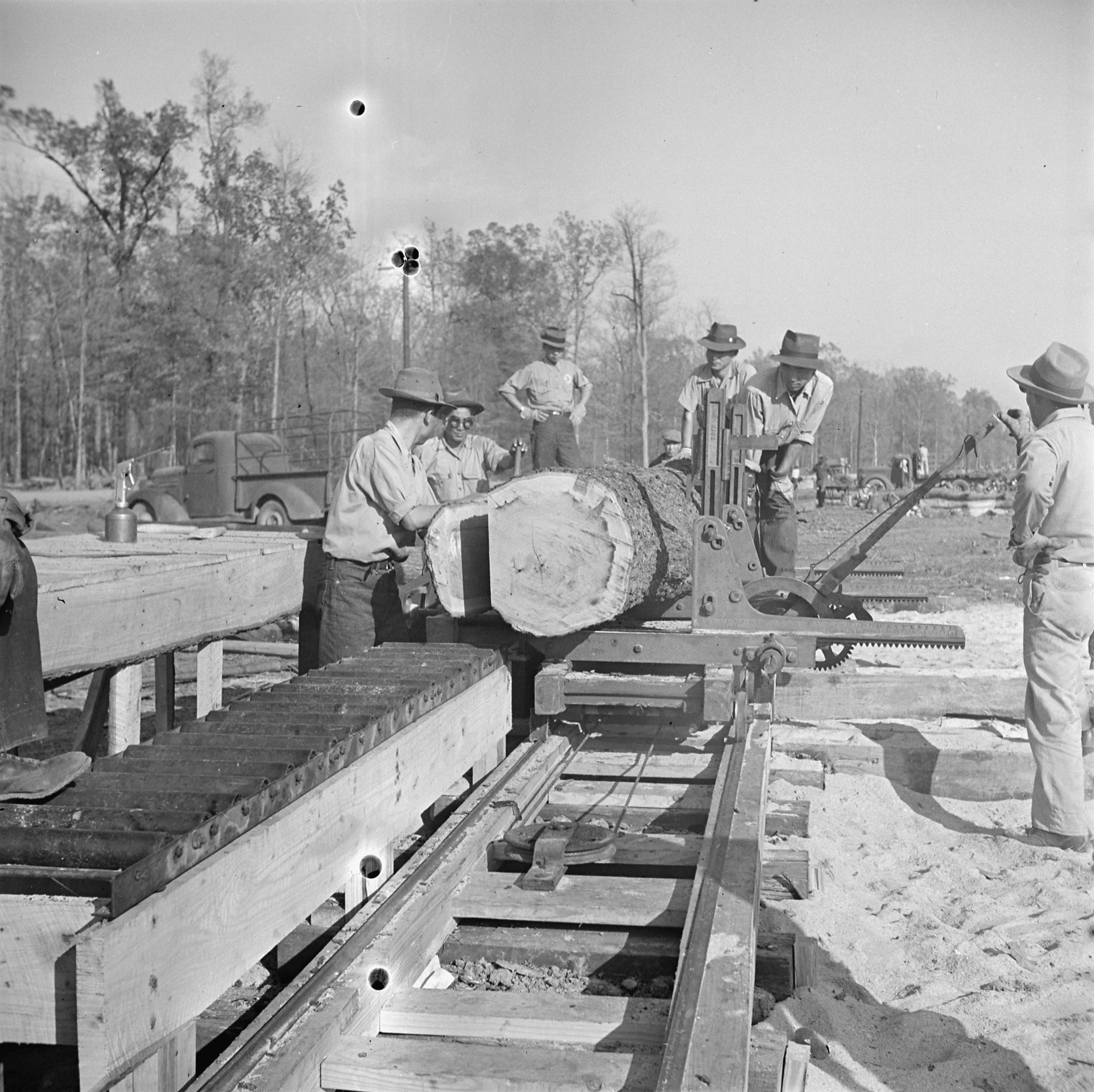 Men working at a saw mill, Jerome War Relocation Center, Arkansas, United States, 16 Nov 1942, photo 2 of 2