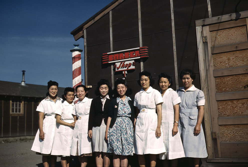 Japanese-American women outside a barber shop in the Tule Lake Relocation Center, Newell, California, United States, 1942-1943