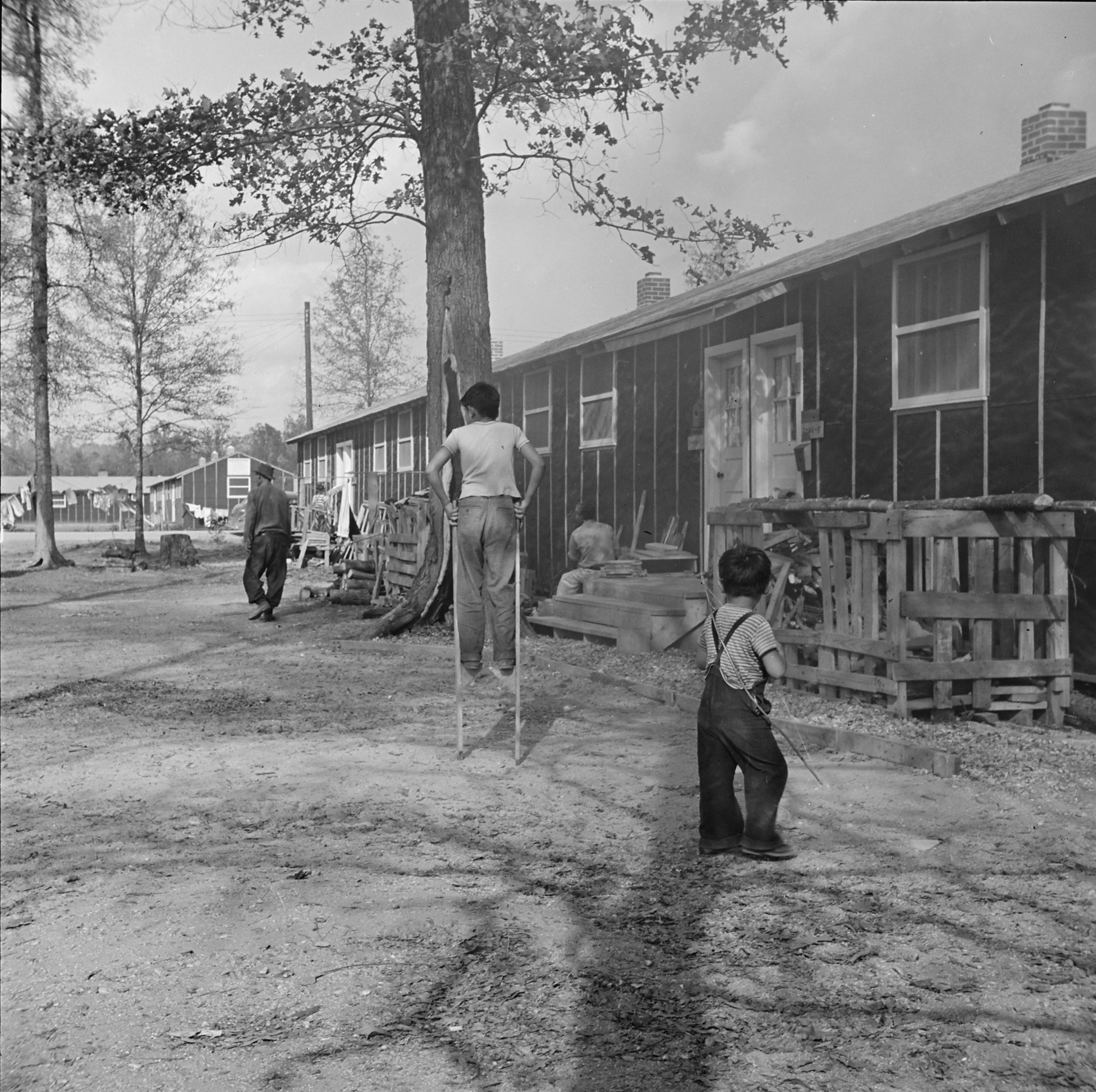 Japanese-American children playing in Block 7 of Jerome War Relocation Center, Arkansas, United States, 18 Nov 1942