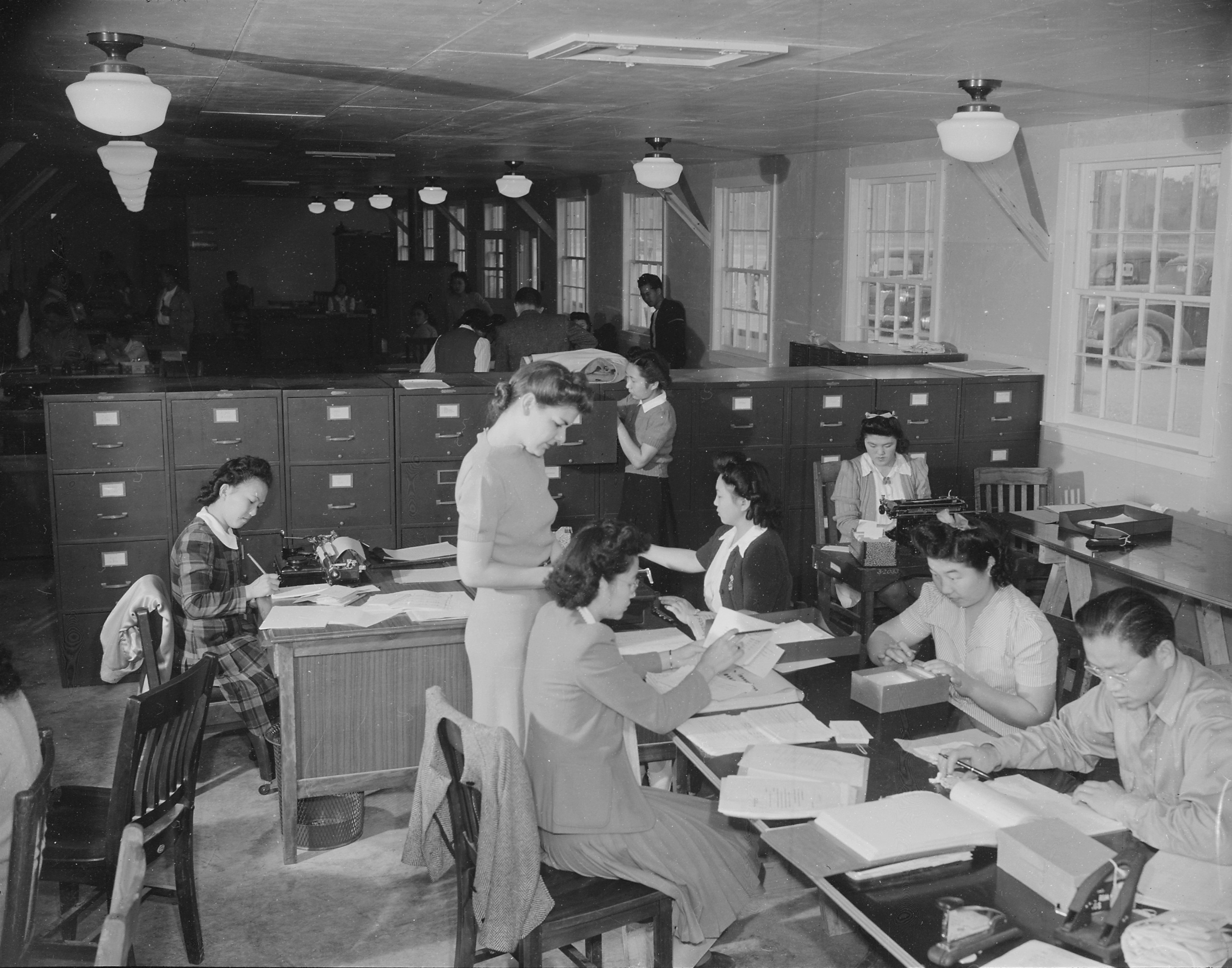 Workers at the office of Personnel Records Section, Jerome War Relocation Center, Arkansas, United States, 19 Nov 1942