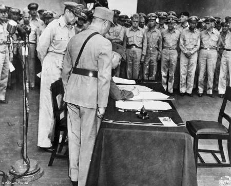 Xu Yongchang signing the surrender document on behalf of China aboard USS Missouri, Tokyo Bay, Japan, 2 Sep 1945, photo 2 of 5