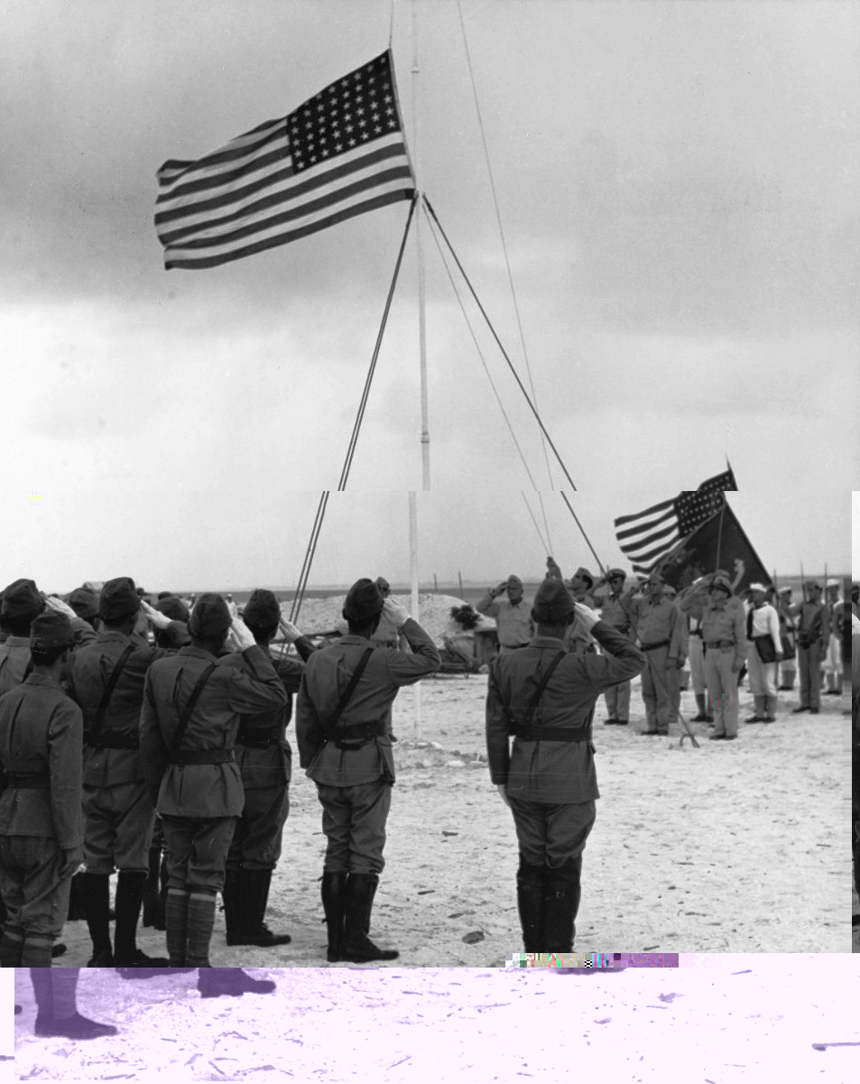 Raising the US flag over Wake Island after Japan's surrender, 4 Sep 1945; Japanese commanding officer Rear Admiral Shigematsu Sakaibara in foreground