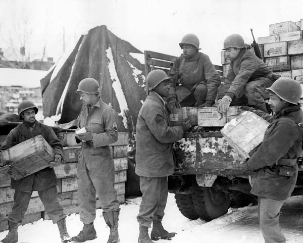 African-American US Army soldiers of 4185th Quartermaster Service Company unloading rations from a truck, Liege, Belgium, 1944