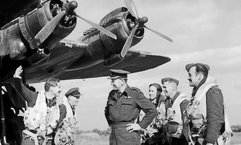 Wing Commander G. E. Harrison of 190 Squadron RAF recounting Operation Market I glider towing mission to Group Captain A. H. Wheeler, Fairford, Gloucestershire, England, United Kingdom, 17 Sep 1944