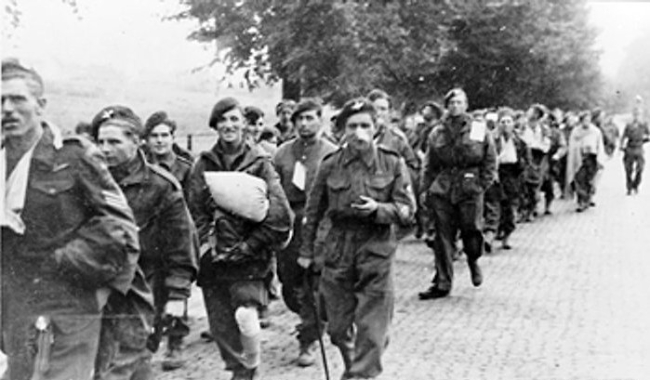 Captured British paratroopers being marched away by German troops, circa 17-25 Sep 1944