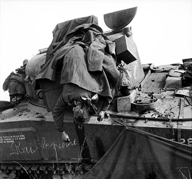 SSM William Parkes of British No. 3 Squadron, 2nd (Armoured) Irish Guards dead on his M4 Sherman tank, near Eindhoven, the Netherlands, 17 Sep 1944