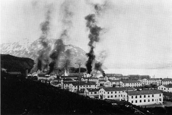 Buildings in Dutch Harbor in flames after Japanese strike, 3 Jun 1942