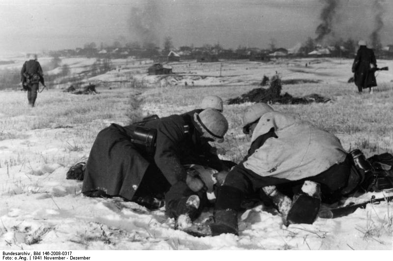 German soldiers treating a wounded comrade, near Moscow, Russia, Nov-Dec 1941