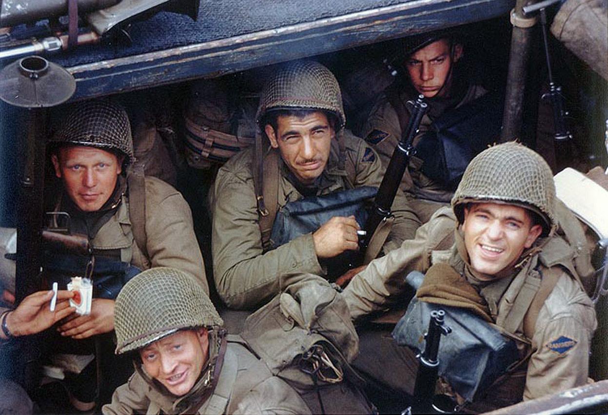 US Army Rangers awaited the invasion signal in a landing craft in an English port, circa early Jun 1944, photo 2 of 2; note the bazooka and the M1 Garand rifles