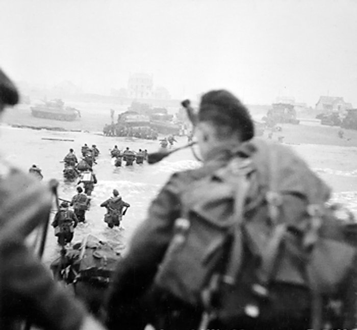 Commandos of the 1st Special Service Brigade, British 2nd Army landing on 'Queen Red' sector of Sword Beach, la Breche, Normandy, France, at 0840 on 6 Jun 1944