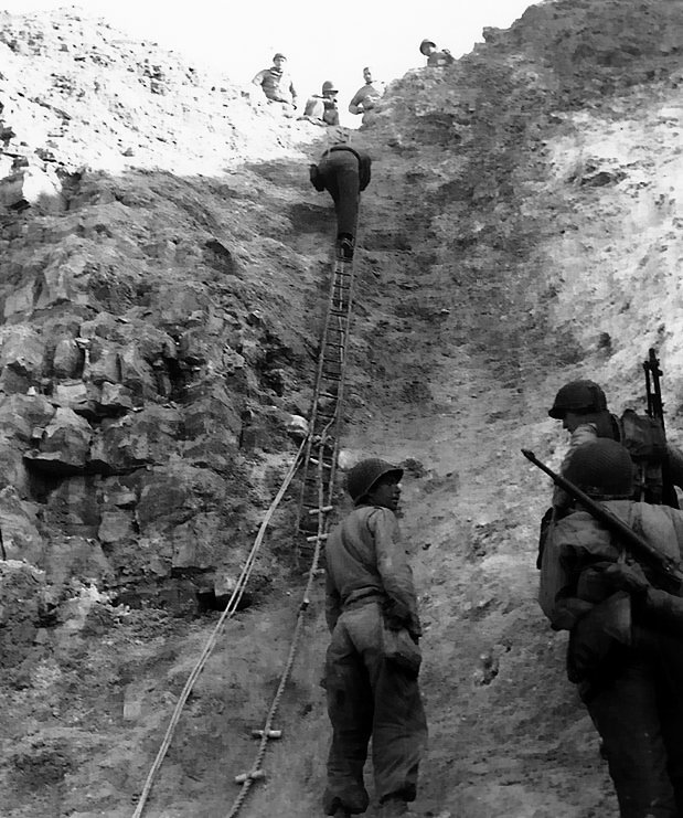 US Army Rangers showing off the ladders they used to storm the cliffs of Pointe du Hoc, Normandy, France, 6 Jun 1944
