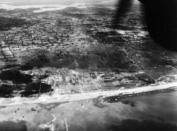 Aerial view of Utah Beach, Normandy, France, morning of 6 Jun 1944; note flooded Merderet River valley at top of photo