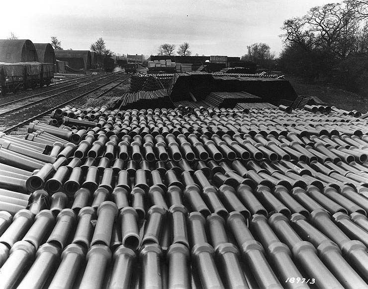 Stockpile of Pipe at a US Army supply base in England, United Kingdom in preparation for the invasion of France, 25 Apr 1944