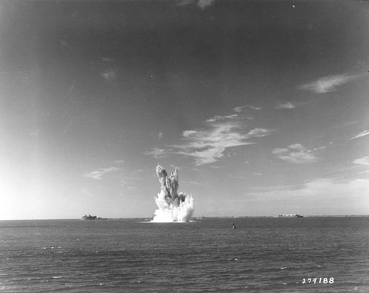 Two British minesweepers detonated German mines in Cherbourg's Grande Rade, just before the entry of supply ships, 2 Jul 1944; note Fort l'Ouest in the background
