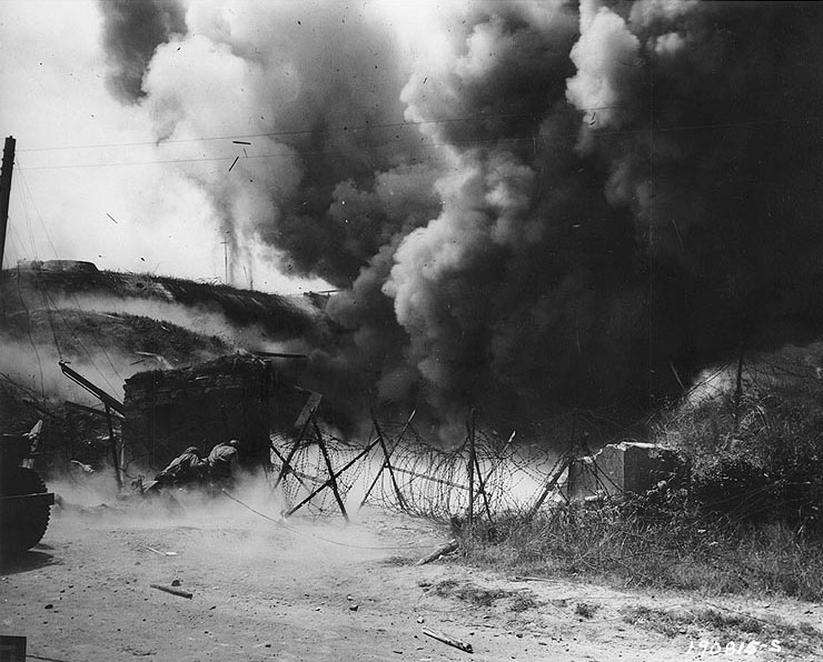 US Army troops attempted to blow up a German pillbox near Cherbourg, 28 Jun 1944