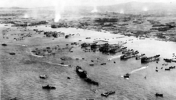 American ships unloading supplies on the beach of Okinawa, Japan, 4 Apr 1945