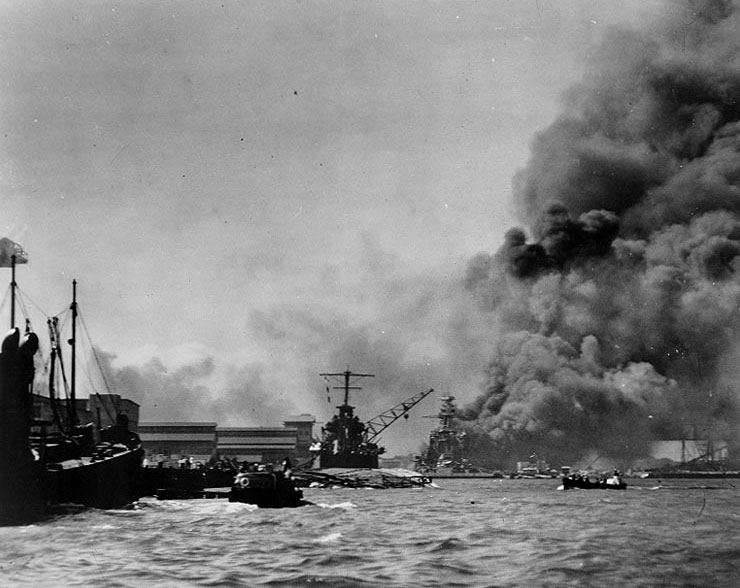 Pearl Harbor viewed from Pier 1010 on 7 Dec 1941; note capsized Oglala, Helena beyond, and Pennsylvania in background