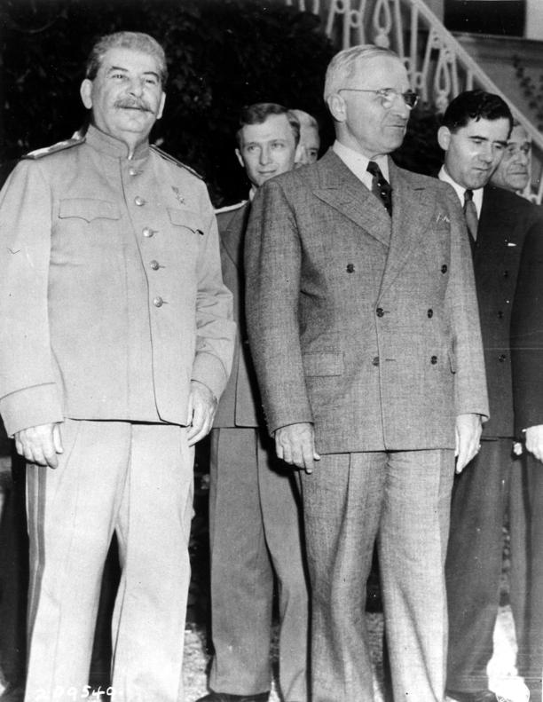 Joseph Stalin and Harry Truman during the Potsdam Conference, Germany, 20 Jul 1945; note V. N. Pavlov and Andrei Gromyko in background