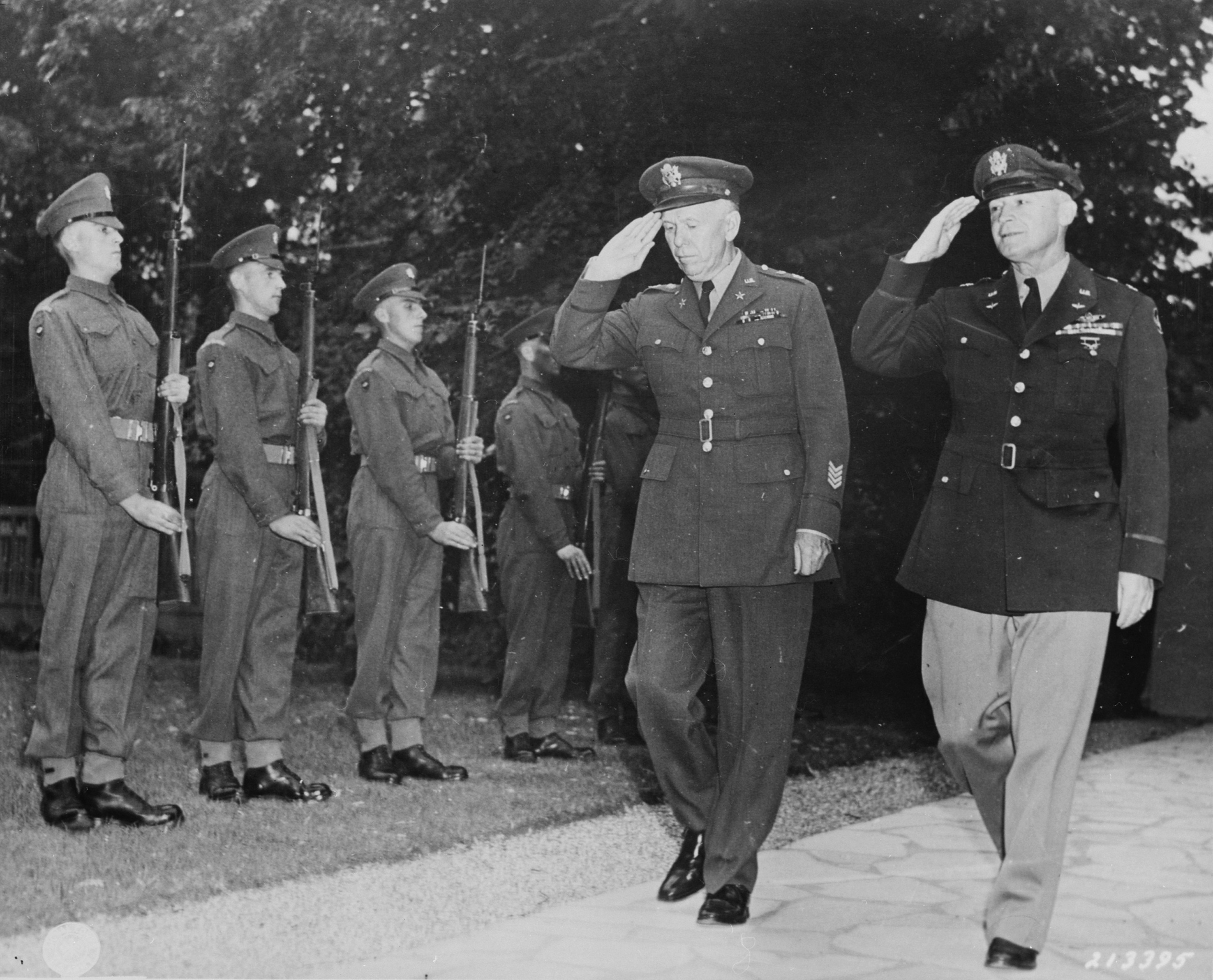 George Marshall and Henry Arnold arriving at Winston Churchill's residence during the Potsdam Conference, Germany, 23 Jul 1945; note British Scots Guards regiment honor guard