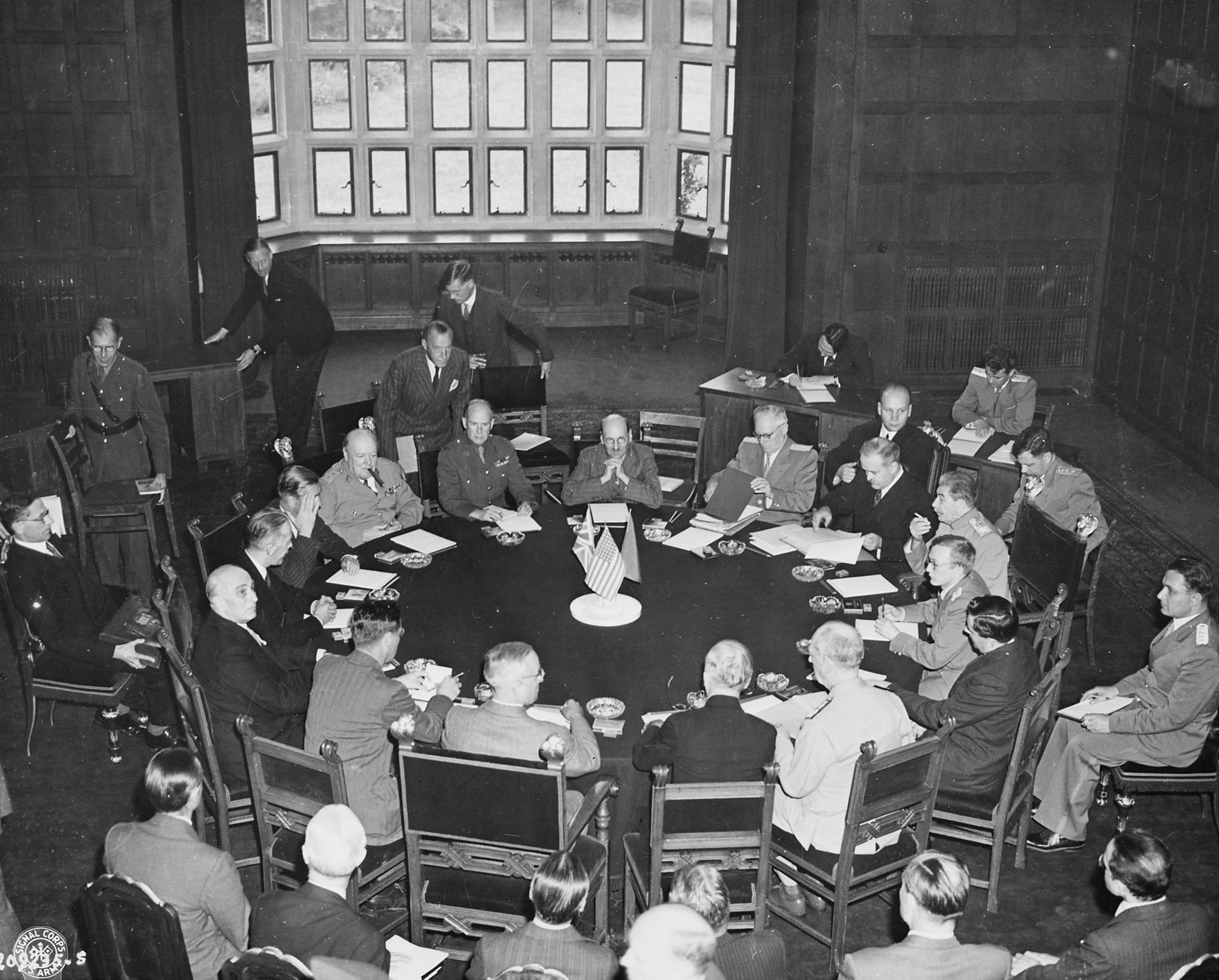 Harry Truman, James Byrnes, William Leahy, Joseph Stalin, Vyacheslav Molotov, Anthony Eden, Winston Churchill, and others in conference at Schloss Cecilienhof, Potsdam, Germany, 17 Jul 1945