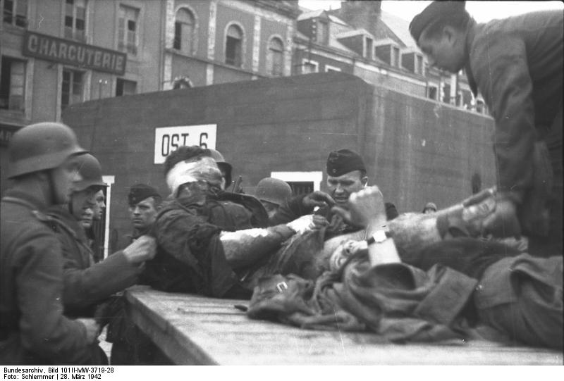 German troops evacuating wounded British commandos, Saint-Nazaire, France, 28 Mar 1942