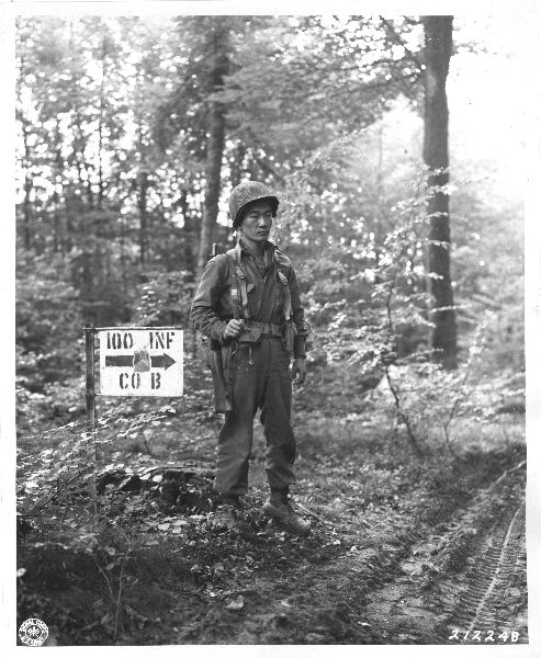 Japanese-American soldier of the 100th Infantry Battalion, 442nd Regiment, US 34th Infantry Division standing guard, near Chambois, France, 12 Oct 1944