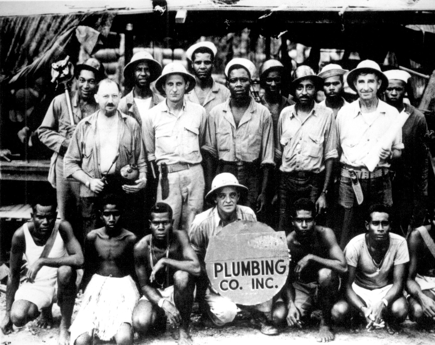American and native personnel of the plumbing department of Halavo Seaplane Base, Florida Island, Solomon Islands, date unknown