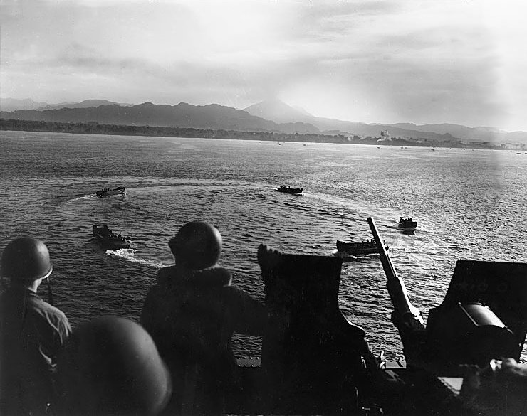 LCVP landing craft circling off Cape Torokina, Bougainville, Solomon Islands while awaiting orders, 1 Nov 1943; note 20mm Oerlikon AA gun; photographed from aboard APA-13 USS American Legion