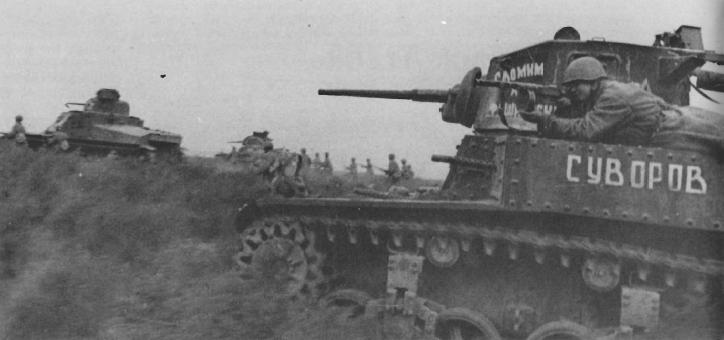 US-made M3 Stuart light tanks and M3 Lee medium tank in Russian service, Stalingrad, Nov 1942; note soldier with PPSh-41 submachine gun