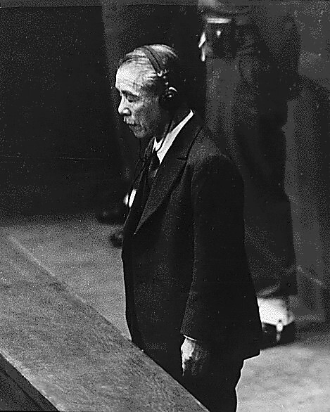 Former Prime Minister Koki Hirota listening to Sir William Webb of Australia sentencing him to death at the International Military Tribunal for the Far East at Ichigaya Court, Tokyo, Japan, 12 Nov 1948