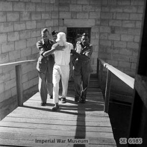 Japanese Army Lt Nakamura being led to the scaffold where he would be executed by hanging for beheading an Indian soldier at Pulau Island near Singapore during the war, 14 Mar 1946
