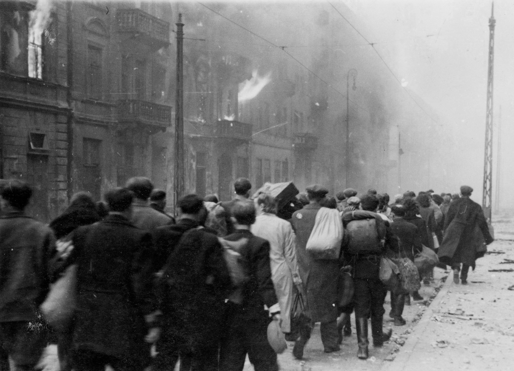 Jews being marched to the Umschlagplatz rail station for deportation, Warsaw, Poland, Apr-May 1943