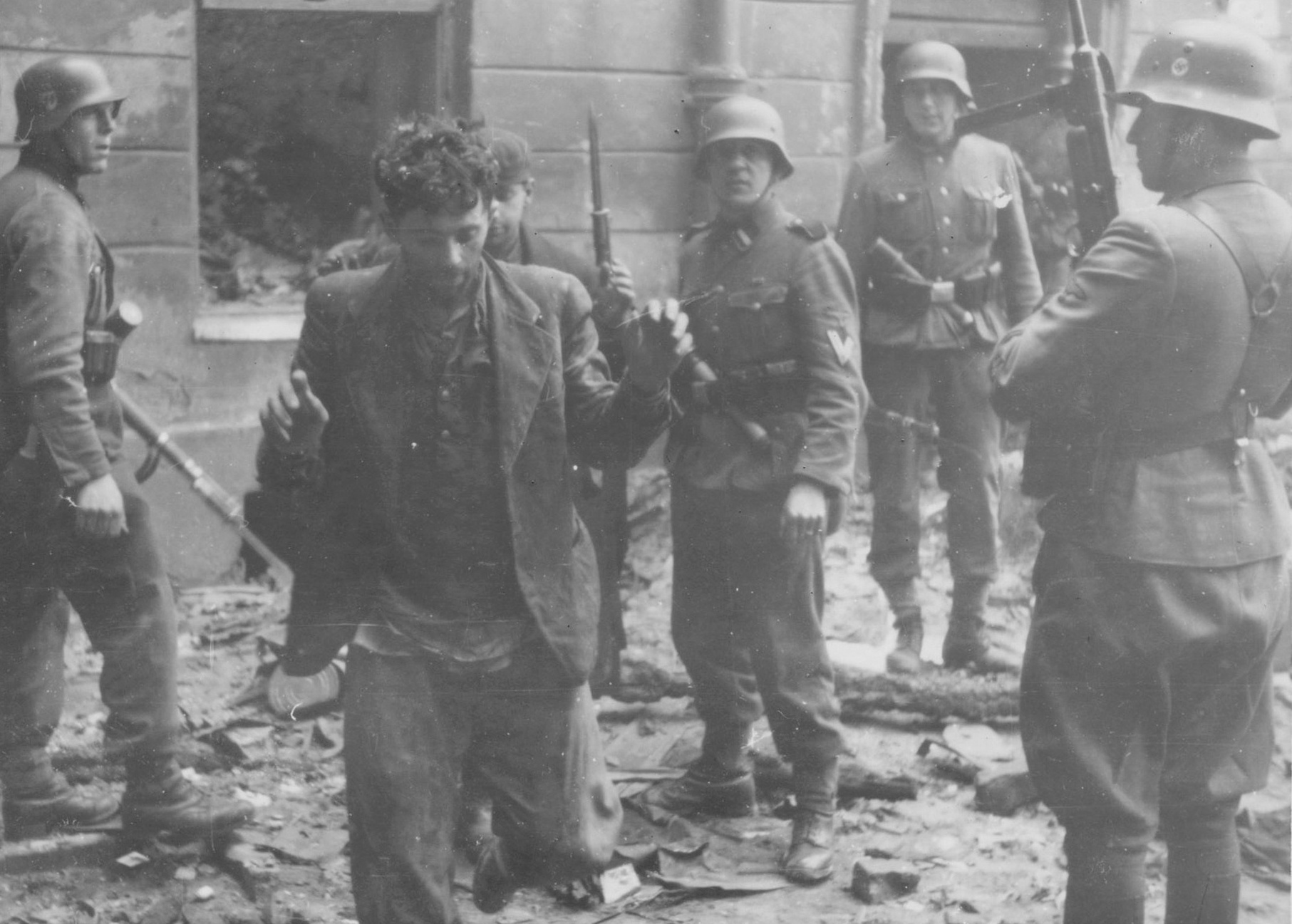 SS troops guarding suspected Jewish resistance fighters, Warsaw, Poland, Apr-May 1943