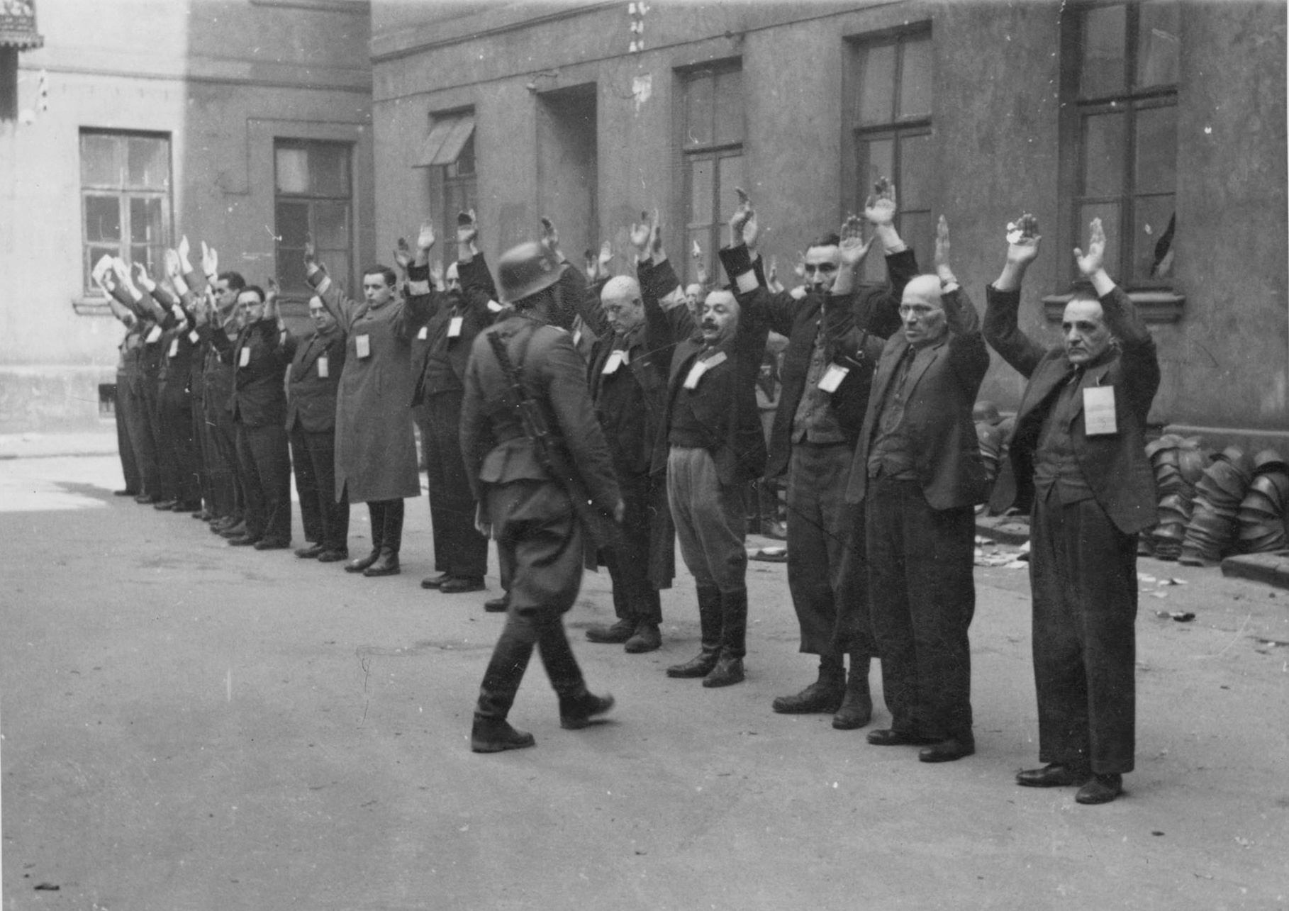 Arrested Jewish department heads of the Brauer helmet factory, Warsaw, Poland, shortly after 1700 hours on 24 Apr 1943, photo 1 of 2