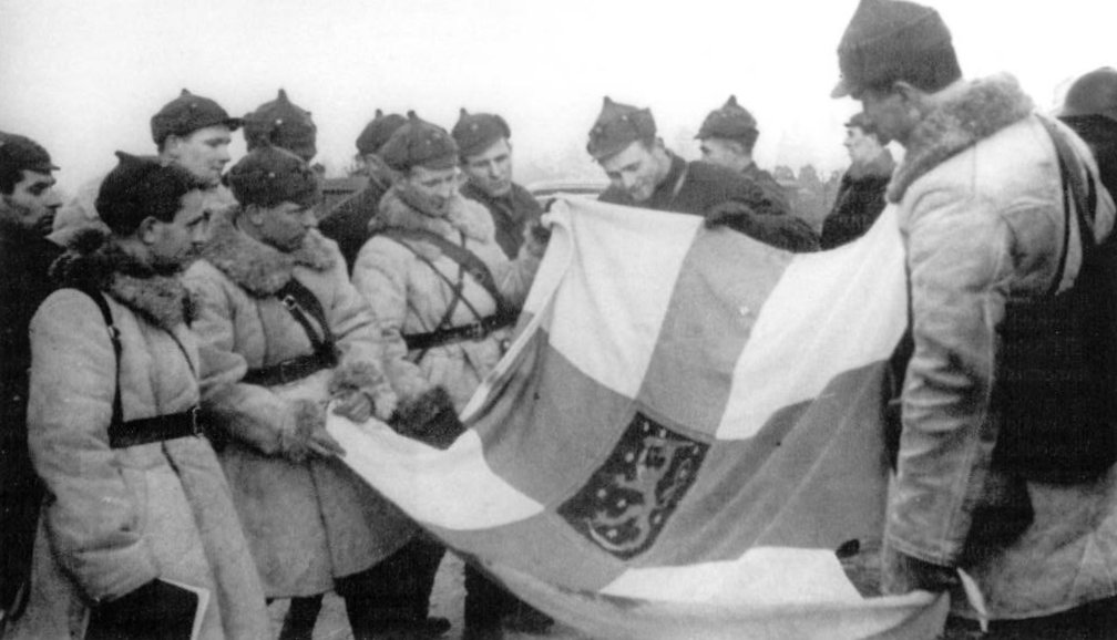 Soviet troops with a captured Finnish state flag, Finland, 1939-1940