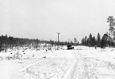Wrecked Soviet T-26 tank in Finland, near the Kemijärvi-Märkäjärvi road somewhere in western Finland, 1940; this tank was repoted destroyed by Swedish volunteers