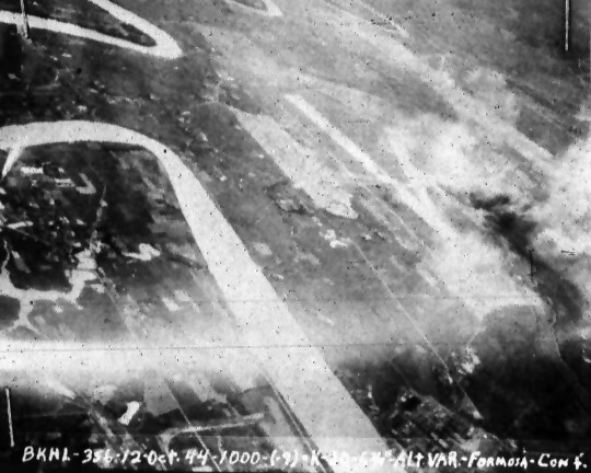 Matsuyama Airfield, Taihoku (now Taipei), Taiwan under attack by aircraft from USS Bunker Hill, 12 Oct 1944, photo 2 of 3