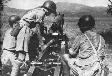 Chinese crew loading a mountain gun in exercise, Ramgarh, India, date unknown