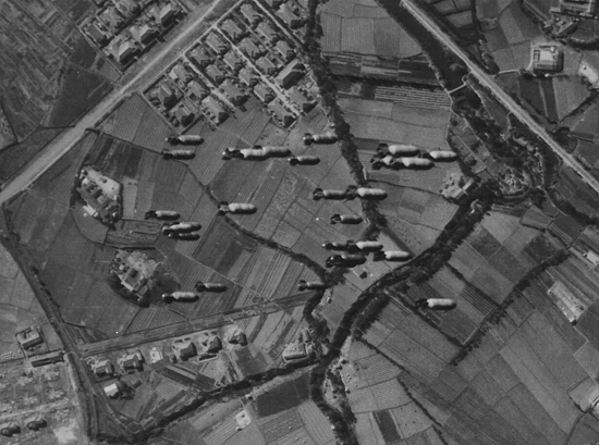 Shinchiku Airfield under B-29 attack, northern Taiwan, 17 Jan 1945, photo 1 of 3