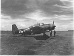 A TBM-3 Avenger with a Marine bombing squadron rests on a Pacific airfield, 1944-1945.