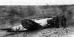 P-47D Thunderbolt of the 367th Fighter Squadron made a belly landing in field artillery position after being hit in the left wing during a dive bombing attack on near Würzburg, Germany, 1 Apr 1945.  The pilot was only slightly injured.