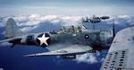SBD Dauntless dive-bombers in flight, 1942-43. Note the dive brakes seen in the foreground.