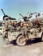 Crew of B-17G Fortress “I’ll Get By” arrive at their airplane by Jeep ay RAF Horham, Suffolk, England, UK; 1944