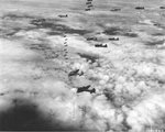 B-17 Fortresses of the 92nd Bomb Group release their bomb loads in Sep 1944, probably over Magdeburg, Germany.